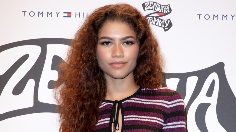 Zendaya smiling with curly/wavy hair in 2019