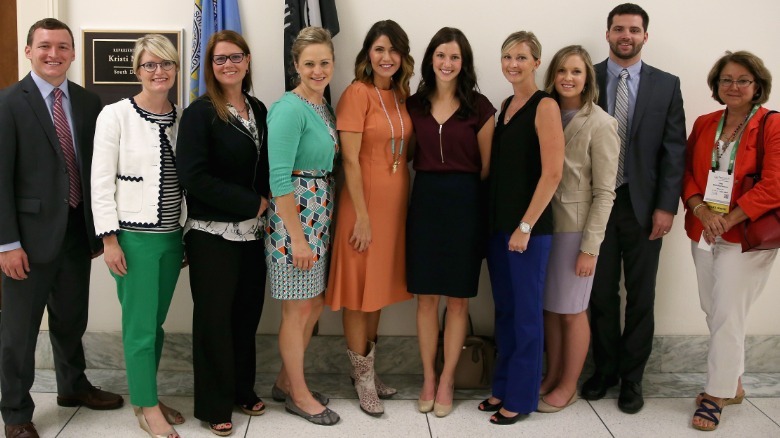 Kristi Noem (center) smiling with the American Optometric Association
