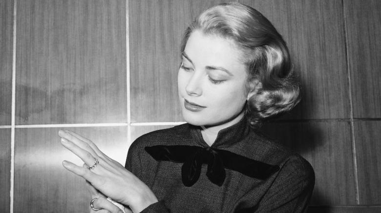 Grace Kelly showing off her engagement ring