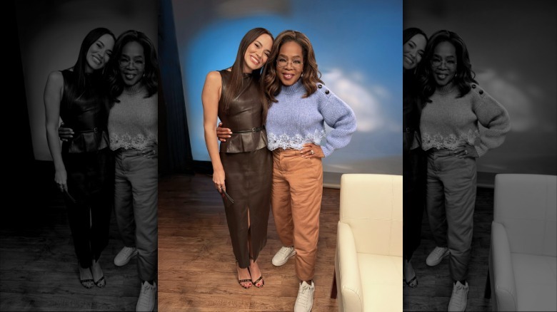 Emily Curl and Oprah Winfrey posing together for pictures.
