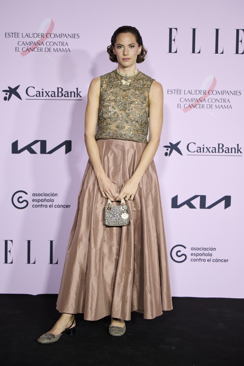 Emma Ferrer wearing an ankle-length dress and a slicked-back hairstyle at an Elle event