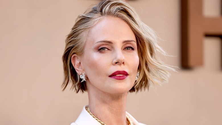 Charlize Theron poses on the red carpet in 2026