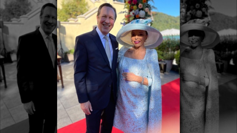 Joan Collins and Percy Gibson pictured together smiling in 2026