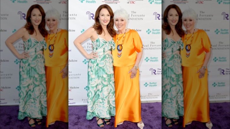 Amy Yasbeck and Joyce DeWitt smiling side by side in 2026