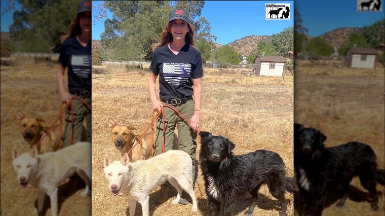 Linda Blair posing with rescue dogs