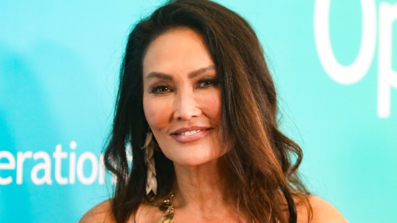 Tia Carrere is pictured smiling on the red carpet in 2026