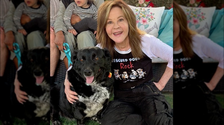 Linda Blair posing with a rescue dog